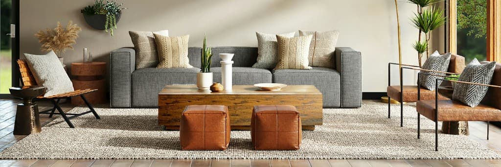 Modern living room with gray sofa and leather seating